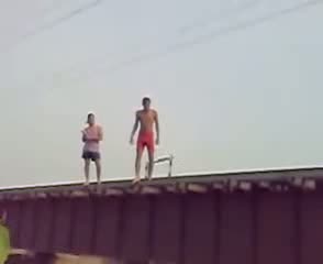 Crazy Indians almost hit by a train - MUST SEE!!