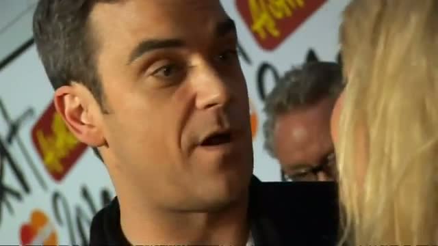 Robbie Williams announces he's going to be a dad video