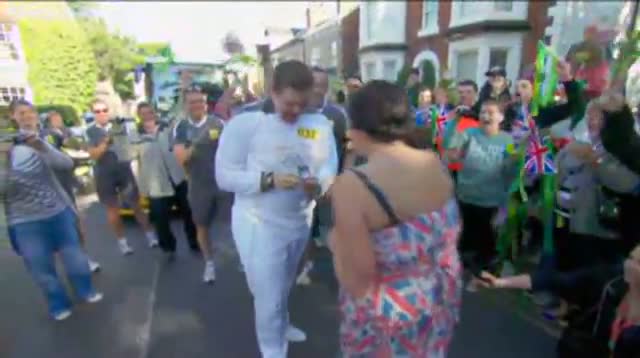 Olympic Torch Bearer Proposes to Girlfriend