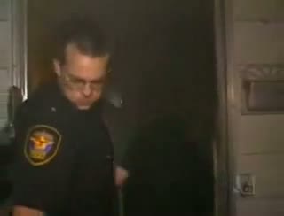 Stupid Cops - Cop Kicks In The Door At The Wrong House.