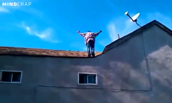 Crazy dude does backflip off roof