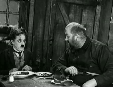 Charlie Chaplin eating his shoe - The Gold Rush (High Quality)