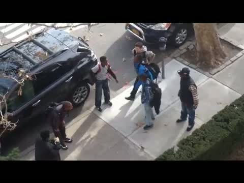 Guy breaks up fight from his window