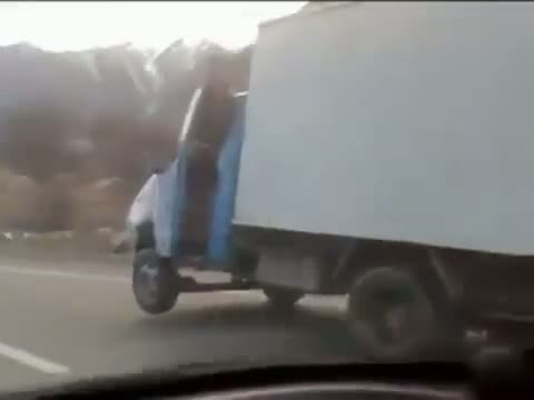 Truck Driving On Three Wheels