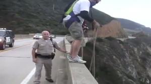 Cop can't stop dude from parachuting off bridge