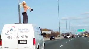 Hottie Dances on Roof of Moving Van