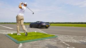 David Coulthard Catching a Golf Ball in Mercedes AMG