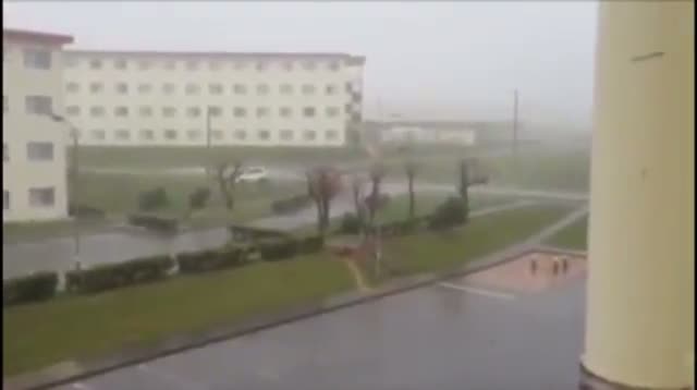 Raw - Typhoon Picks Up, Flips Car