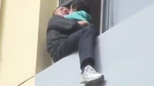 Man Holding Baby Suicide Attempt