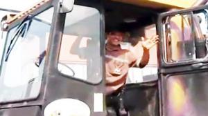 Forklift Operator Puts Coin in Bottle