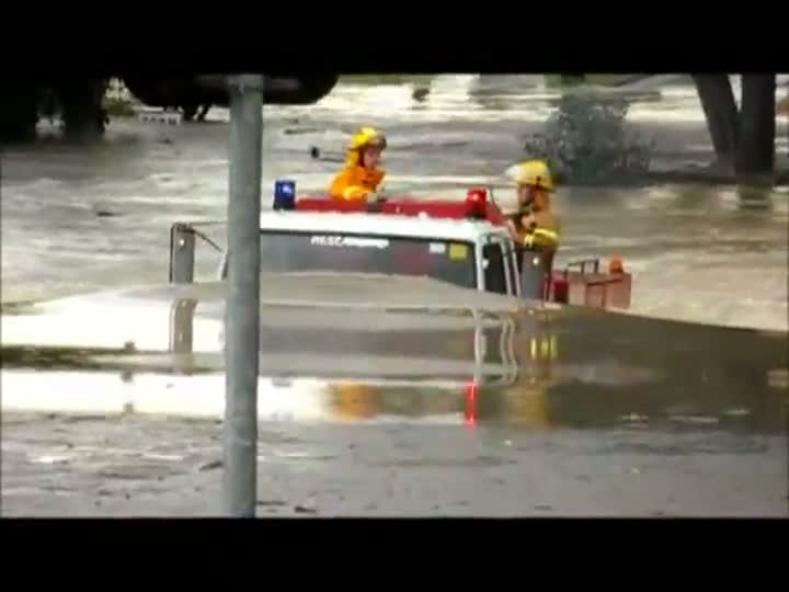 Fire Truck Drives Through Flood
