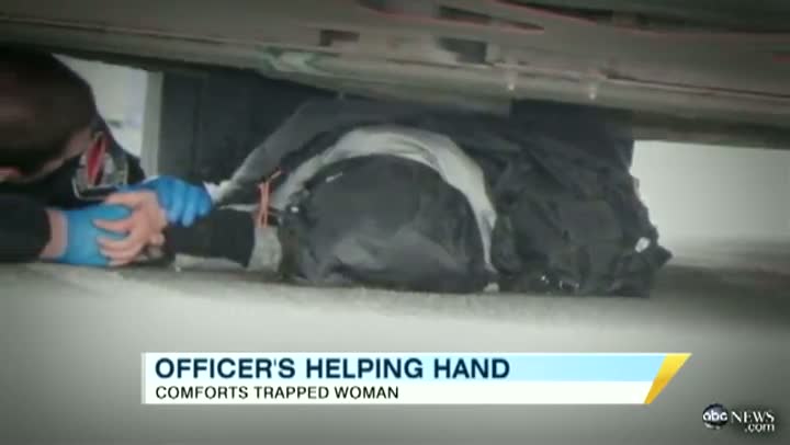Officer Crawls Under Bus to Comfort Woman Pinned Under Wheel