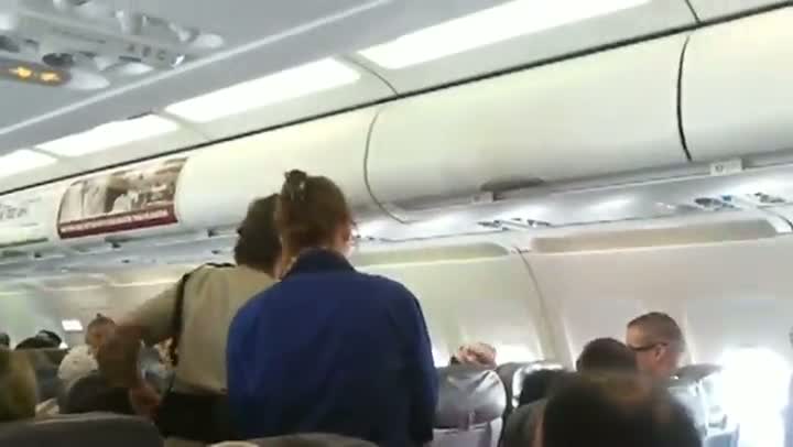 Woman in Vegas Escorted Off The Plane