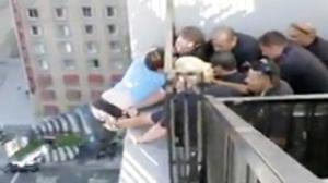 LAPD Officers Rescue Suicidal Man Dangling From Building