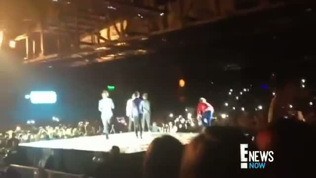 Harry Styles Goes Down on Stage
