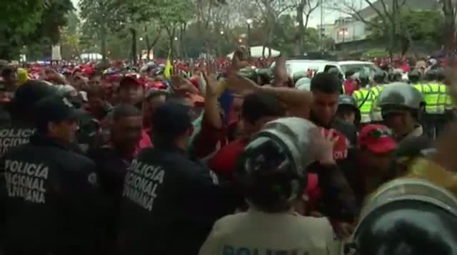 Chavez Supporters Escort Late Leader