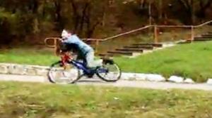 Kid Falls From a Bike and Faceplants