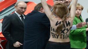 Topless protesters surprise Putin during German Trip