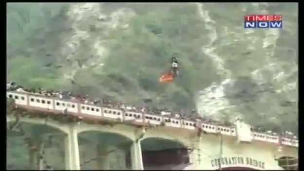 Indian stuntman dies during world record bid to cross river on a zip-wire attached only by his HAIR