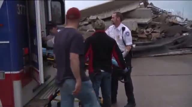 Rescuers Pull Tornado Survivors to Safety