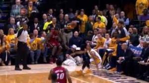NBA: LeBron James falls into Shaq's lap!