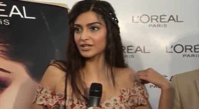 Sonam Kapoor adjusts SLIPPING DRESS