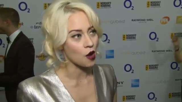Kimberly Wyatt offers men dance tips at the Nordoff Robbins Silver Clef Awards