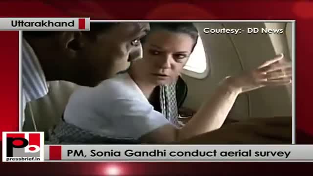 PM, Sonia Gandhi conduct aerial survey of flood-hit U'khand; Rs. 1,000 cr relief announced