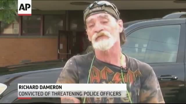 Ohio Man Who Threatened Cops Holds 'Idiot' Sign