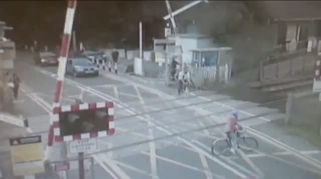 Train Narrowly Misses Cyclist in UK