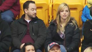 Guy Avoids Kiss Cam With Clever Sign