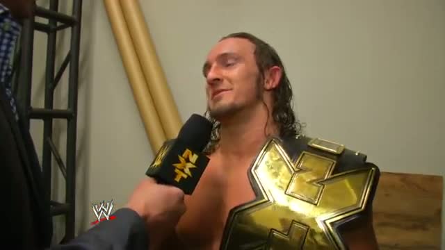 Adrian Neville celebrates winning the NXT Championship