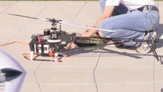 Two RC Helicopters Lift A Woman Airborne