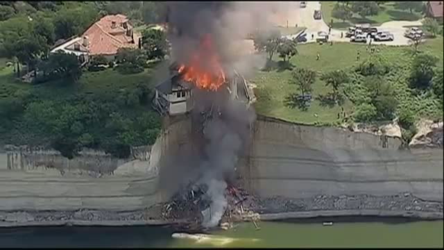 Fire Crews Burn House on Texas Cliff