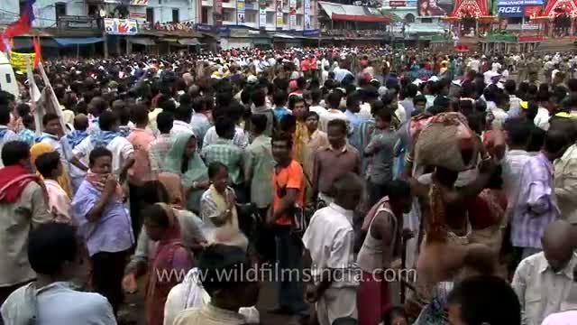 Crowds rally around the chariots during Jagannath Rath Yatra in Puri