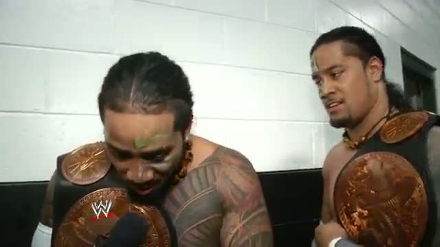 The Usos celebrate a successful WWE Tag Team Title defense: Money in the Bank, June 29, 2014