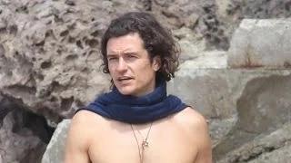 Why Is Orlando Bloom Wearing Rolled Up Sweats At The Beach?