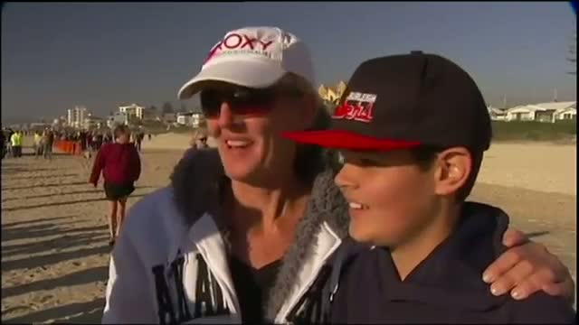 Rescuers Push Beached Whale Back to Ocean