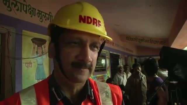 Workers Dig for Survivors After India Landslide