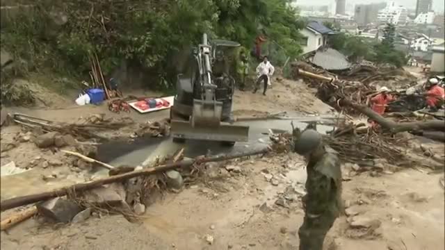 Japan Landslide Rescuers Struggle in Heavy Rain