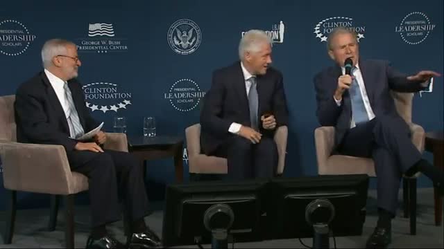 Clinton, Bush Laugh While Launching New Program