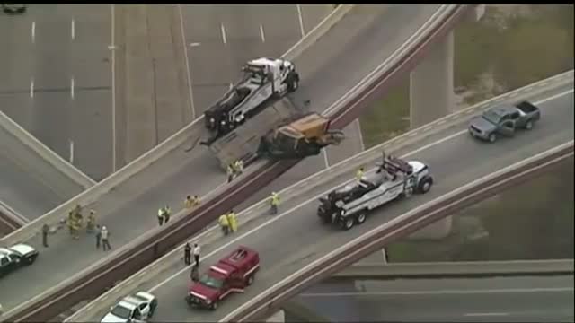 Construction Vehicle Dangles Off Turnpike