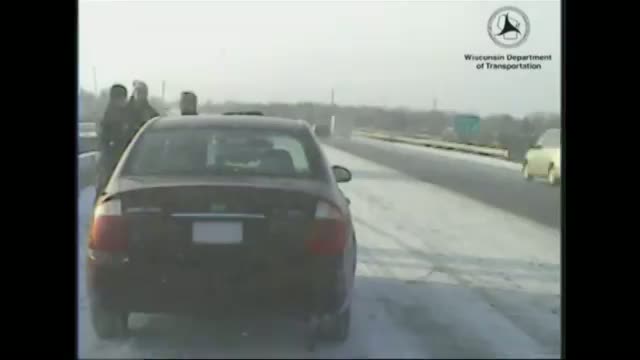 Out of Control SUV Hits Police Car in Snow