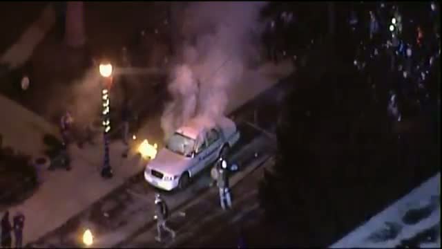 Ferguson Protesters Try to Burn Police Car