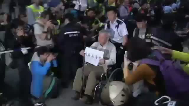 Hong Kong Police Remove Pro-democracy Protests Video