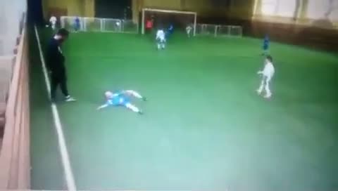 SHOCKING! Russian coach kicks the s*** out of a kid in childrenâ€™s game in Moscow!