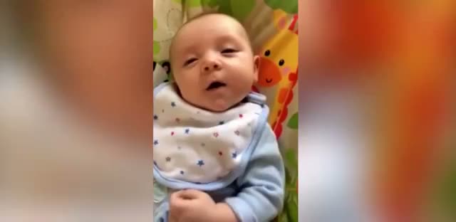 Incredible moment 7-WEEK-OLD baby says hello