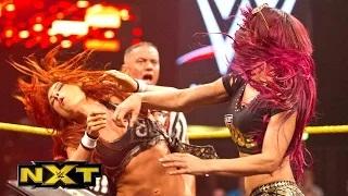 Sasha Banks and Becky Lynch sign the contract for their match at TakeOver: WWE NXT, May 6, 2015