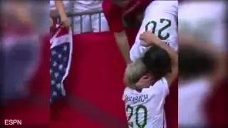 Abby Wambach shares kiss with wife after winning World Cup