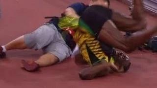 Epic Fail Usain Bolt Taken out by Camera Man After Winning 200M Title at World Championships!